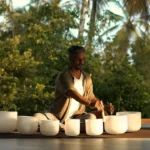 Sunset sound bath meditation training course surrounded by palm trees in Sri Lanka
