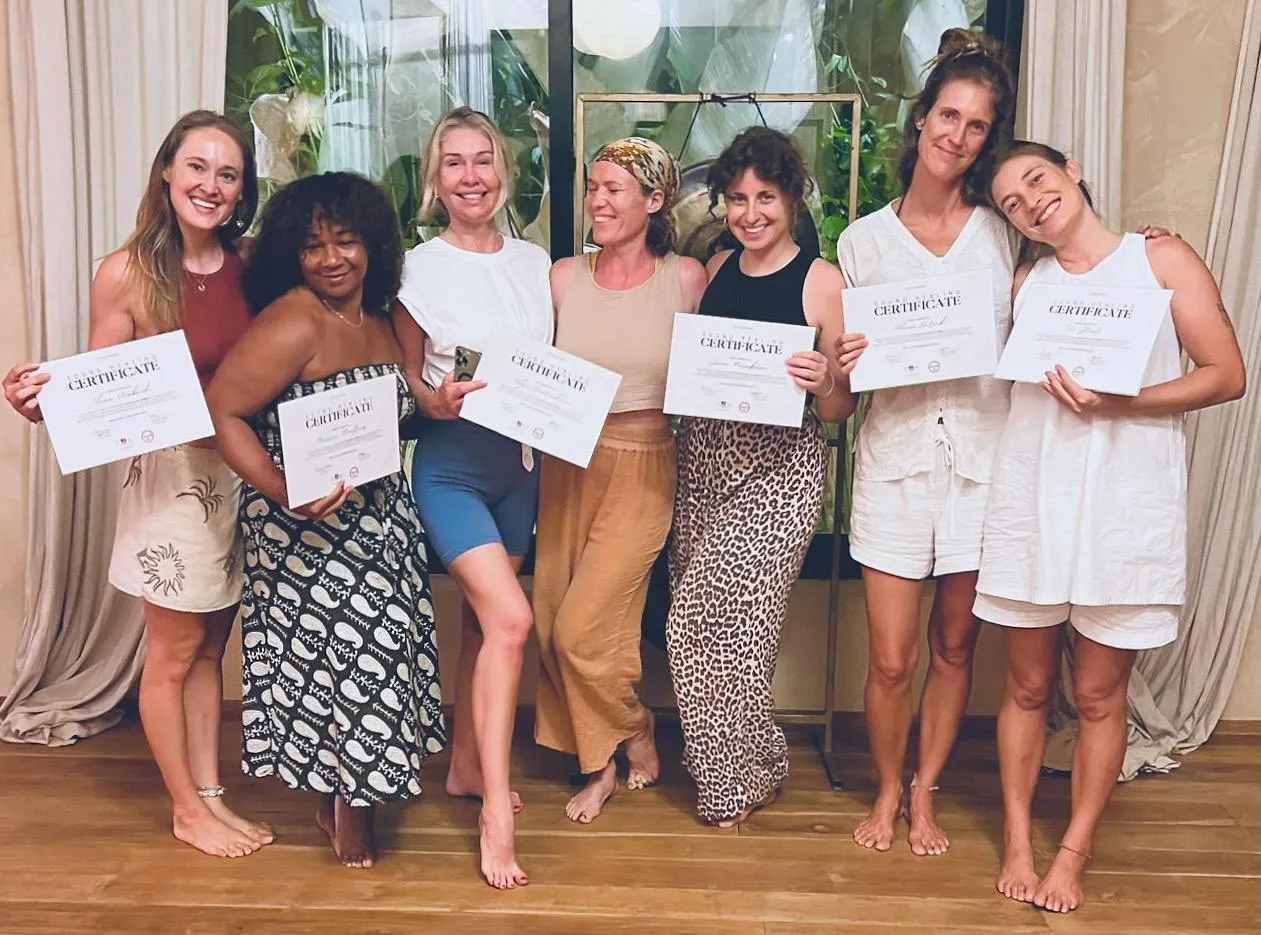 International wellness students smiling and celebrating their graduation at Poetry of Sound therapy training retreat in Sri Lanka